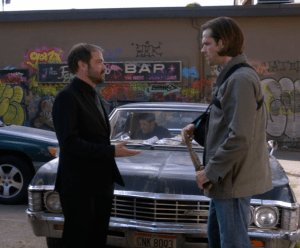 Sam giving blade to Crowley