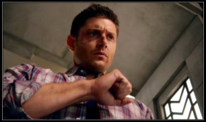 Dean Winchester (Jensen Ackles) examines his hands thinking about the Mark of Cain
